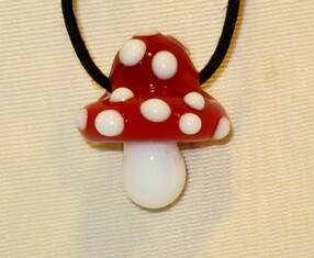 Glass mushroom necklace by Jon Murray