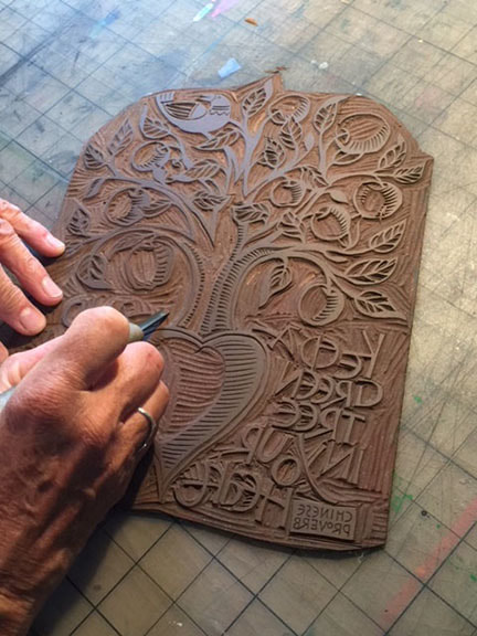 Kathy Sullivan carving a linoleum print