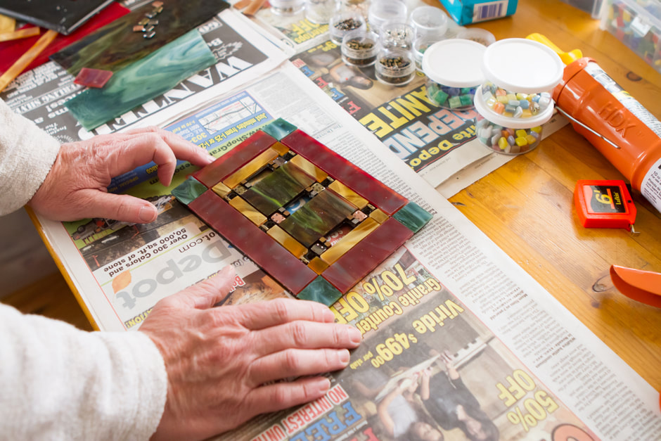 Kay Hall at work on a mosaic piece